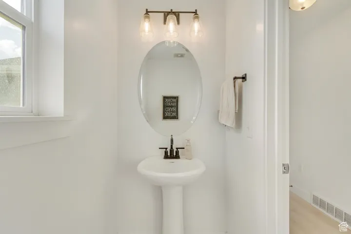 Bathroom with hardwood / wood-style flooring