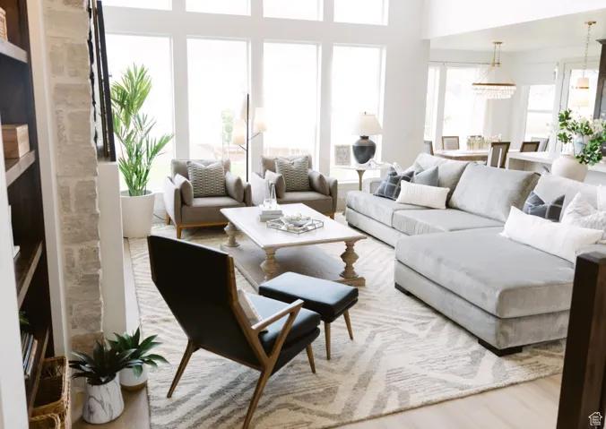 Living room with wood-type flooring and a chandelier