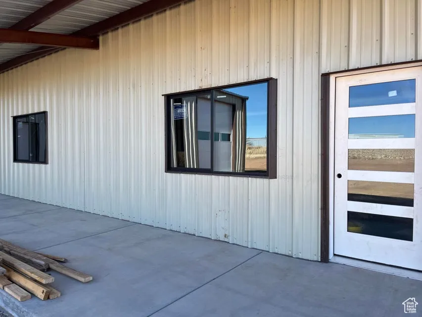 View of side of property with a patio area