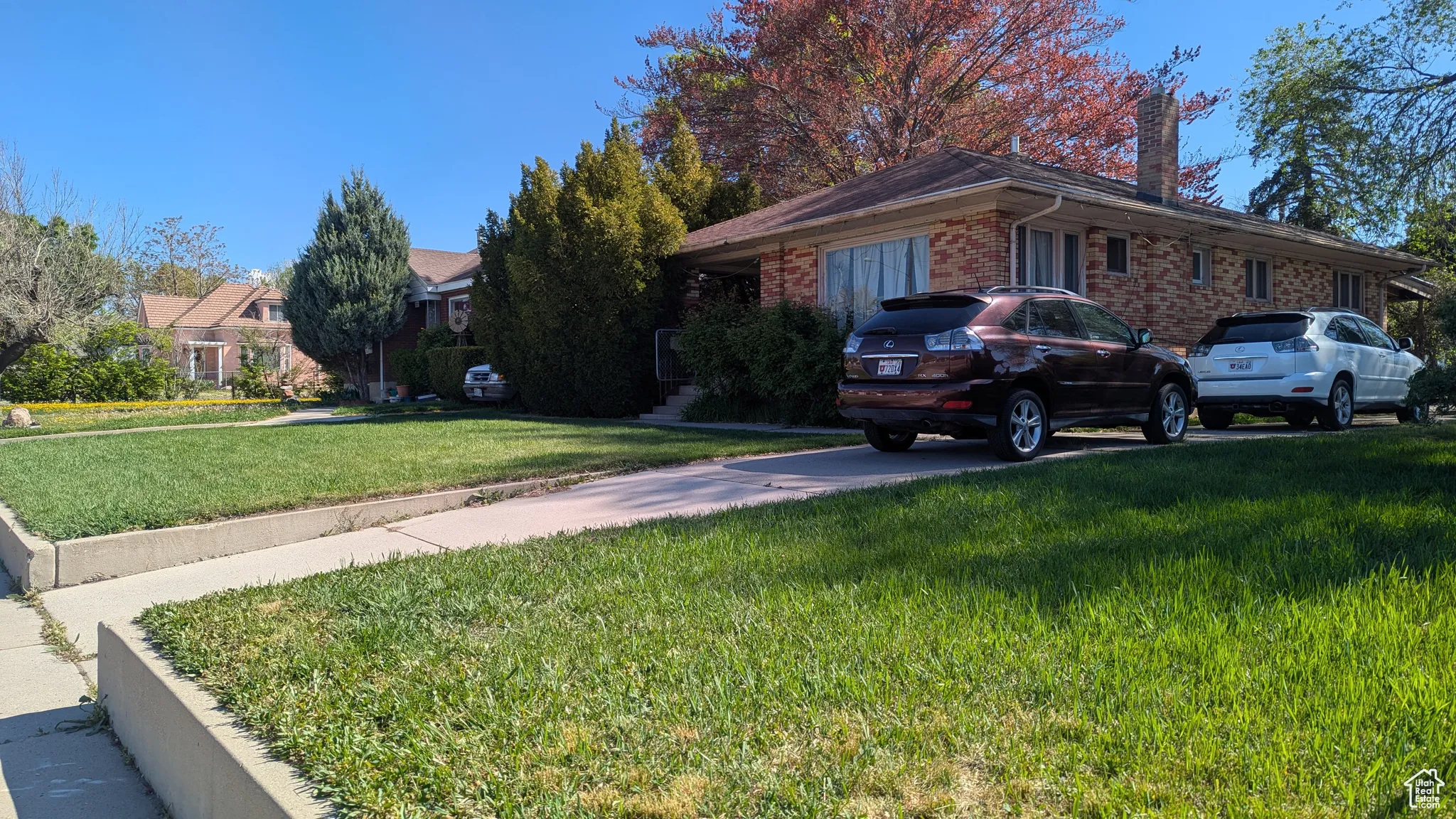3767 South - Ranch-style home with a chimney, a front lawn, and brick siding