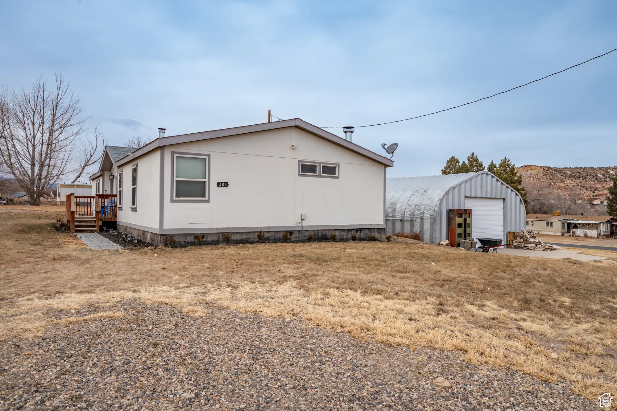 View of property exterior with a garage