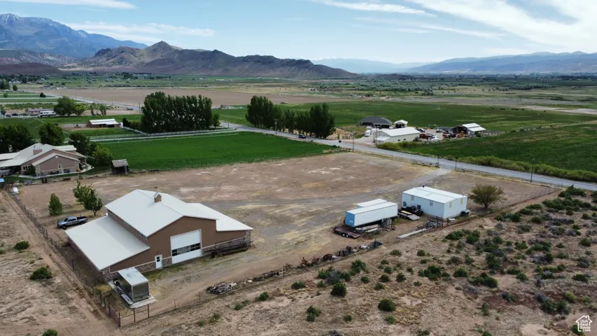 Birds eye view of property featuring a mountain view and a rural view