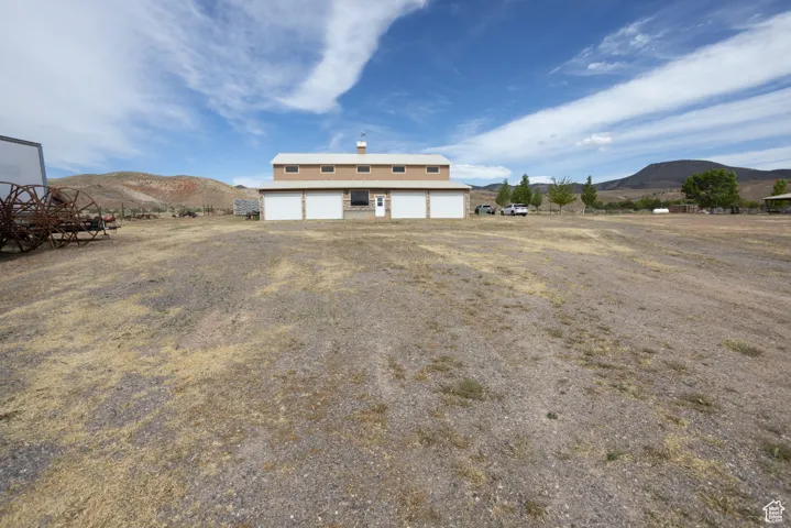 Back of property with a mountain view