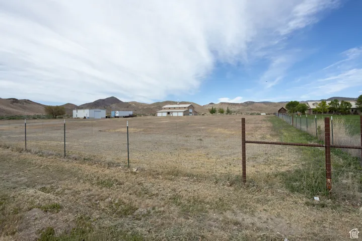 View of yard featuring a mountain view and a rural view