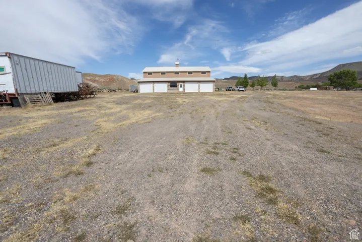 Exterior space with a mountain view and a garage
