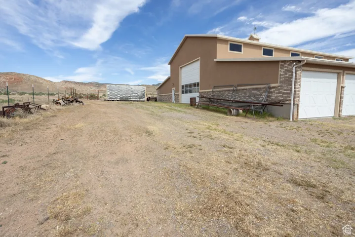 View of yard with a mountain view and an outbuilding
