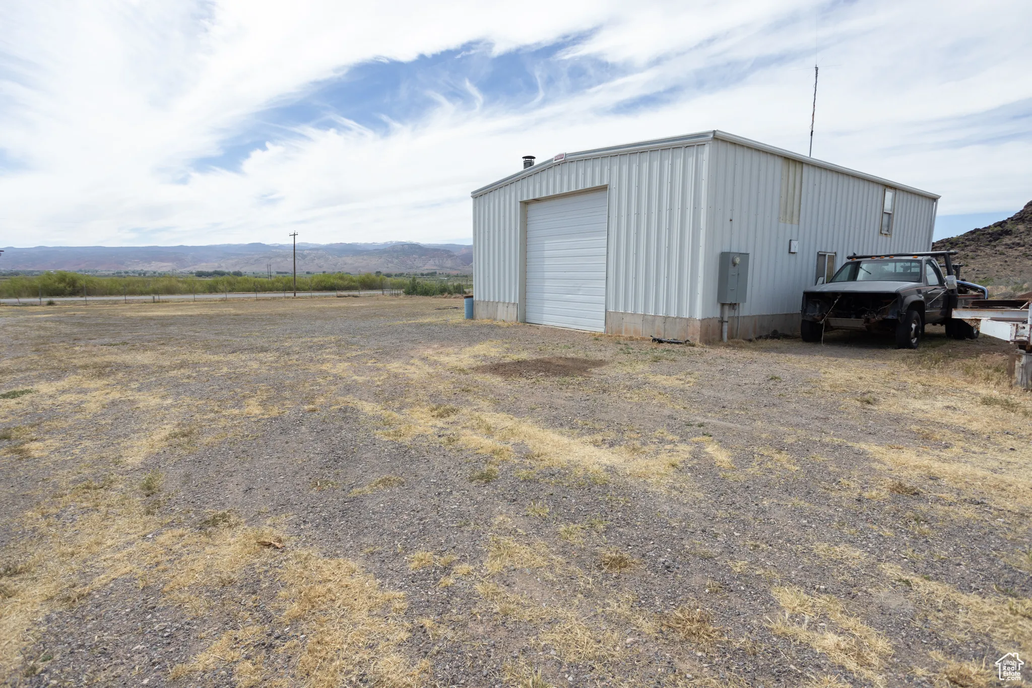 View of outbuilding featuring a garage and a mountain view