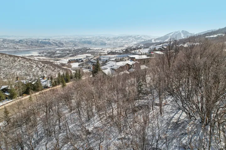 Snowy aerial view featuring a mountain view