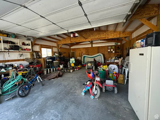 Garage featuring a garage door opener