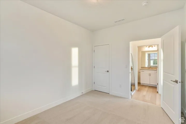 secondary bedroom or office in front of the home with full bathroom adjacent