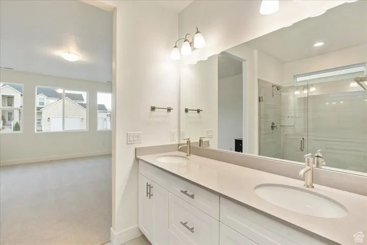 Primary bathroom with quartz counter tops