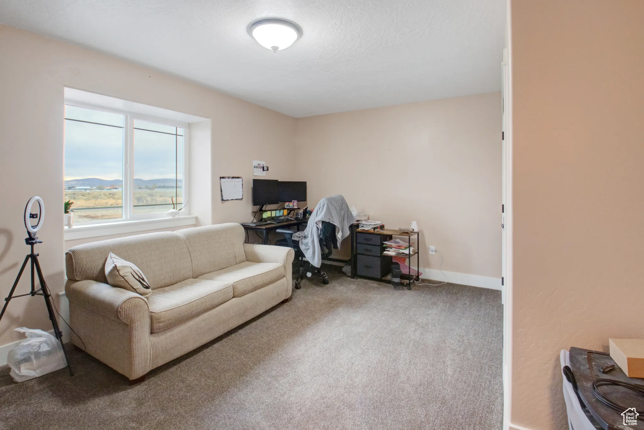 Interior space featuring a textured ceiling