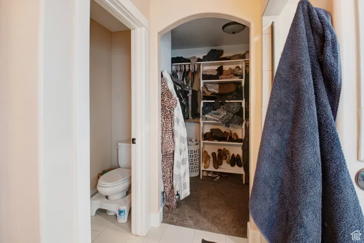 Bathroom with tile patterned floors and toilet