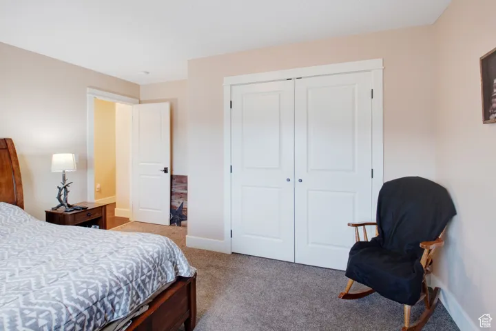 Bedroom featuring a closet and carpet