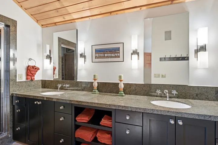 Dual vanity with stone-finish countertop and integrated sinks