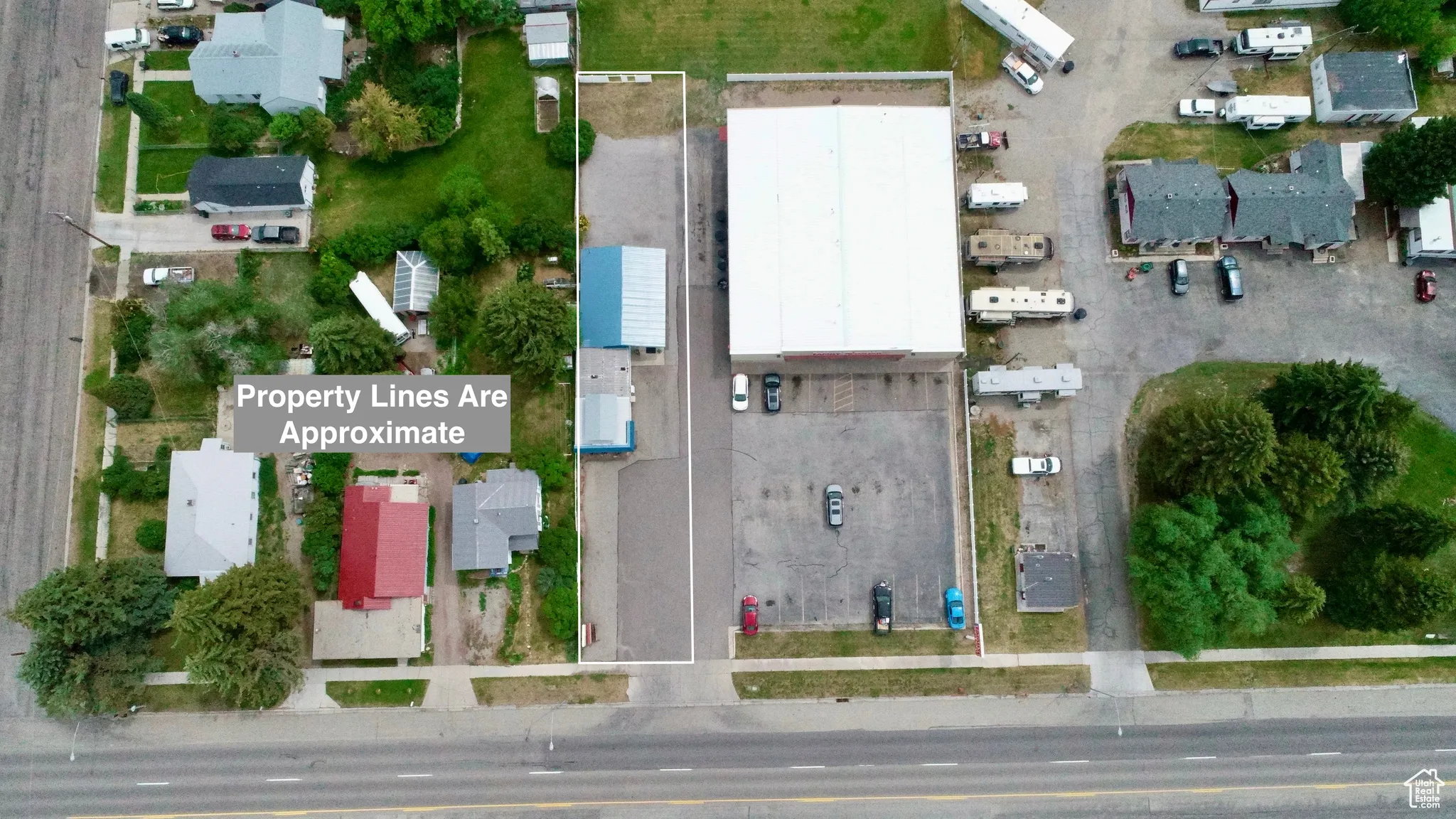 View of property location featuring property parcel outlined and nearby suburban area