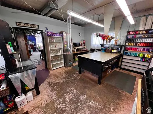 Rec room with concrete flooring