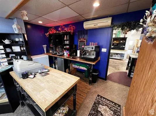 Bar with a drop ceiling and a wall unit AC