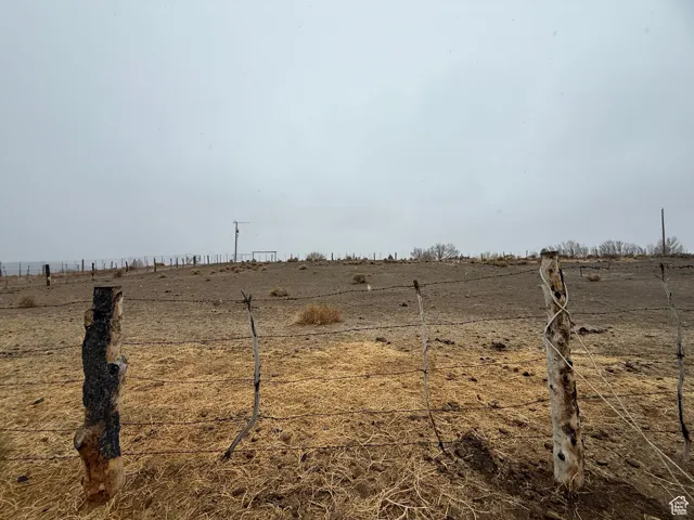 View of yard with a rural view