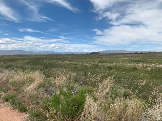 Property view of mountains with a rural view