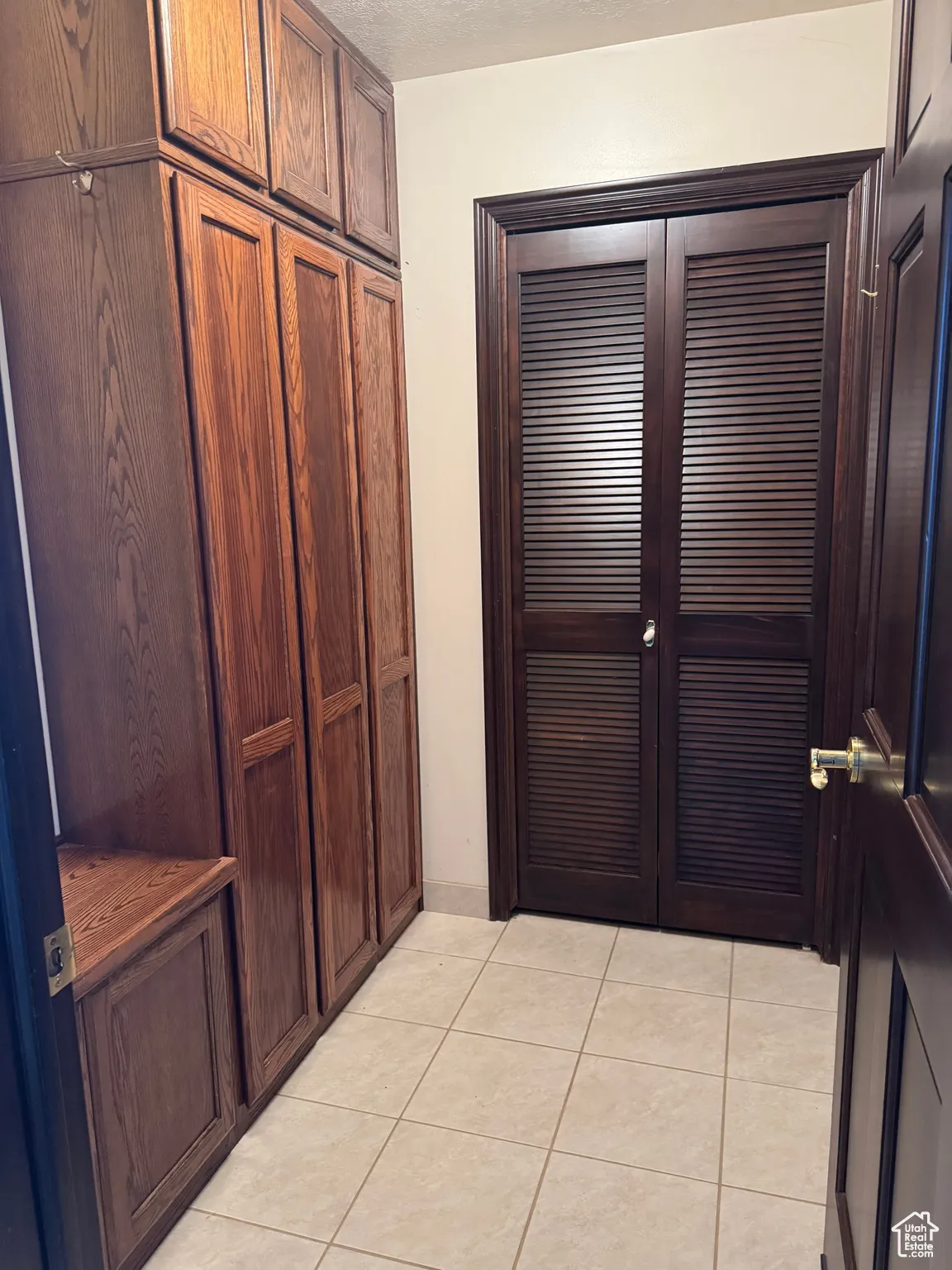 Utility area with water softener, on demand hot water  a furnace that is just over a year old and ski storage