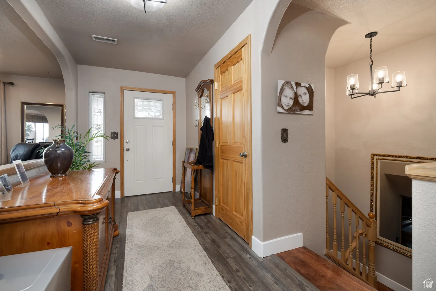 Foyer with closet and entrance to basement