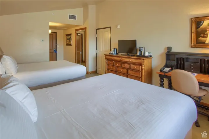 Bedroom featuring vaulted ceiling