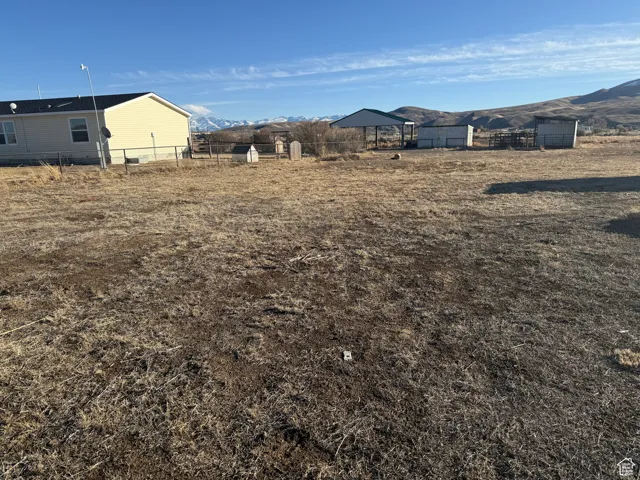 View of yard featuring a mountain view and a rural view