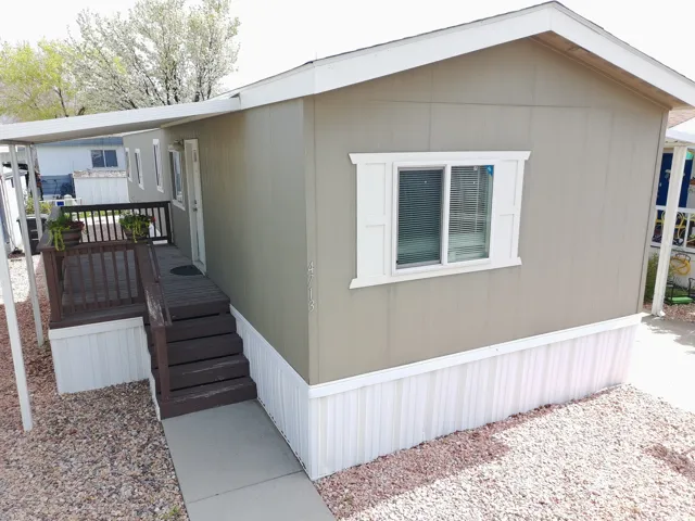 View of front of property featuring a wooden deck