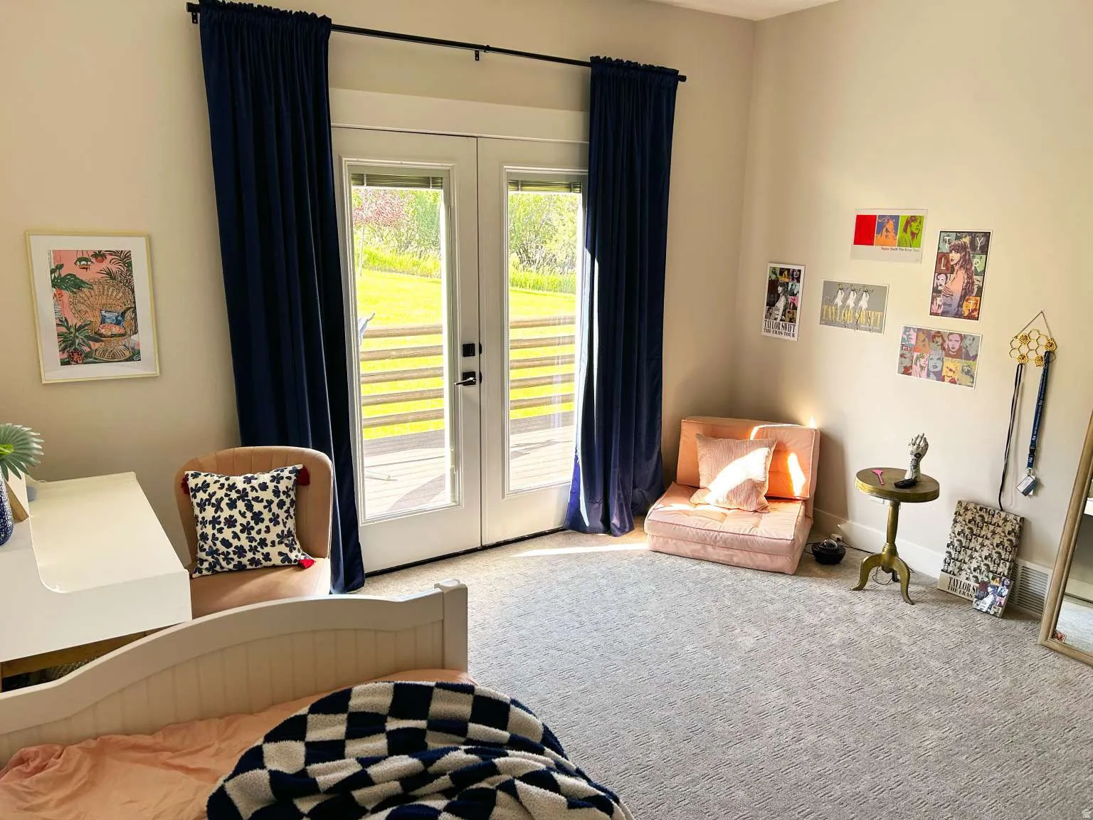 Spacious room featuring light-toned walls and plush gray carpeting