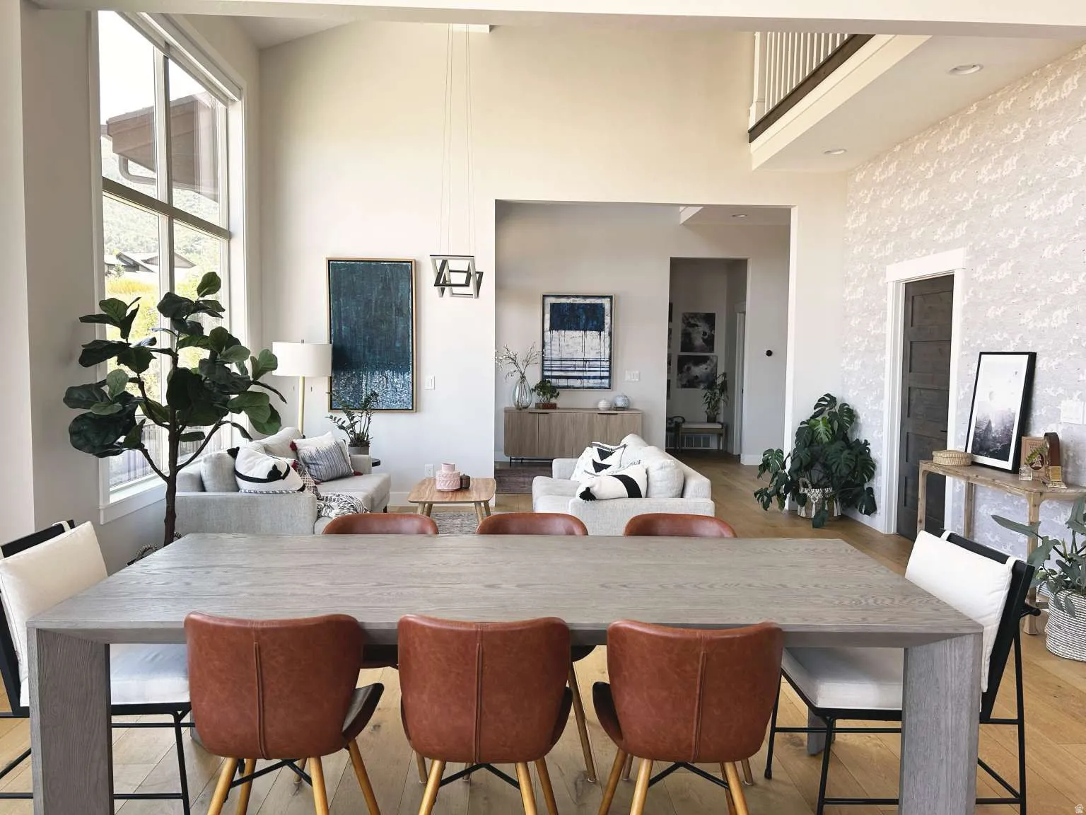 Open-concept main living area featuring wood-finish flooring throughout
