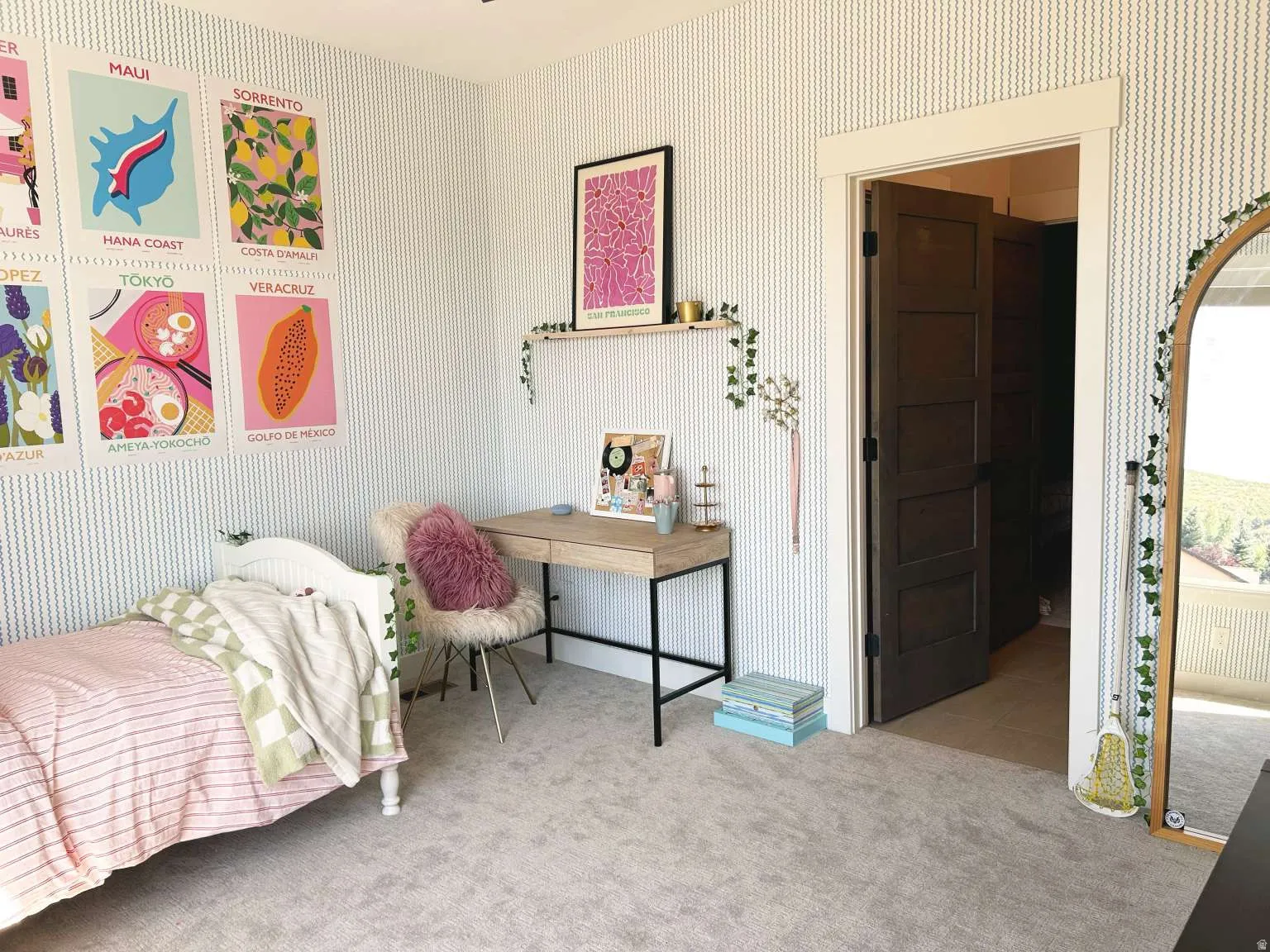 Light gray carpeting throughout, complemented by a patterned wallpaper