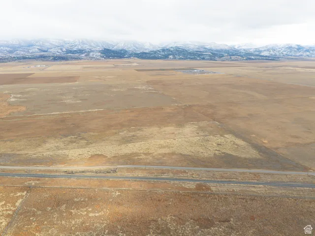 Birds eye view of property featuring a mountain view and a rural view
