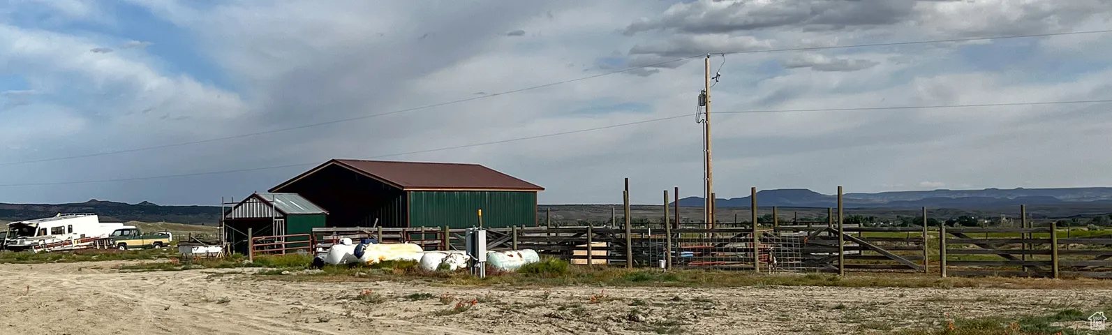 View of outdoor structure with a mountain view and a rural view