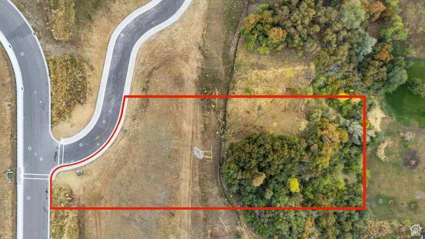 Aerial view of property and surrounding area with property parcel outlined