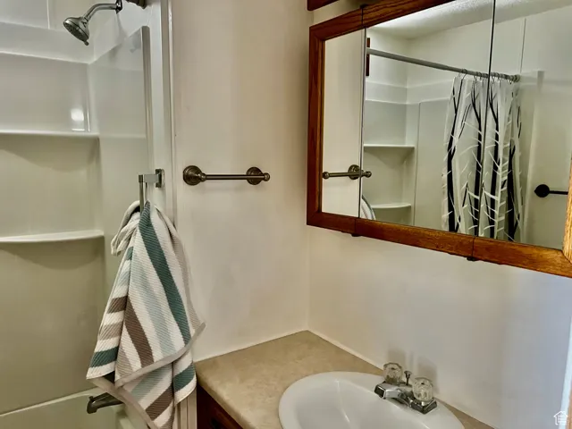 Bathroom with vanity and a shower with curtain