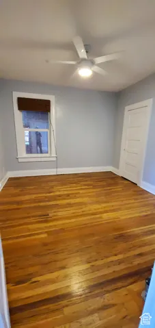 # 9 Master bedroom with light wood-style flooring and ceiling fan
