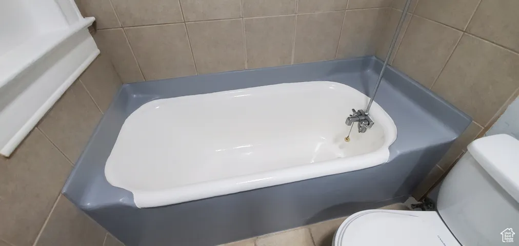 # 9 Bathroom featuring toilet and a tub