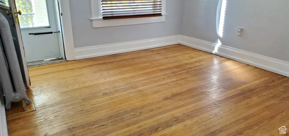 Unit # 4 Detailed view of wood finished floors and radiator