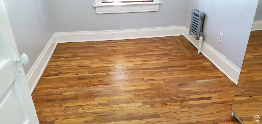 Unit # 3 Detailed view of wood finished floors and baseboards