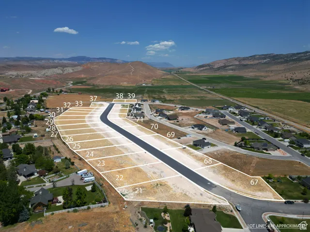 Aerial overview of property's location featuring a mountain backdrop