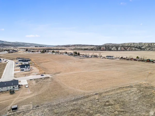 Birds eye view of property featuring a mountain view and a rural view