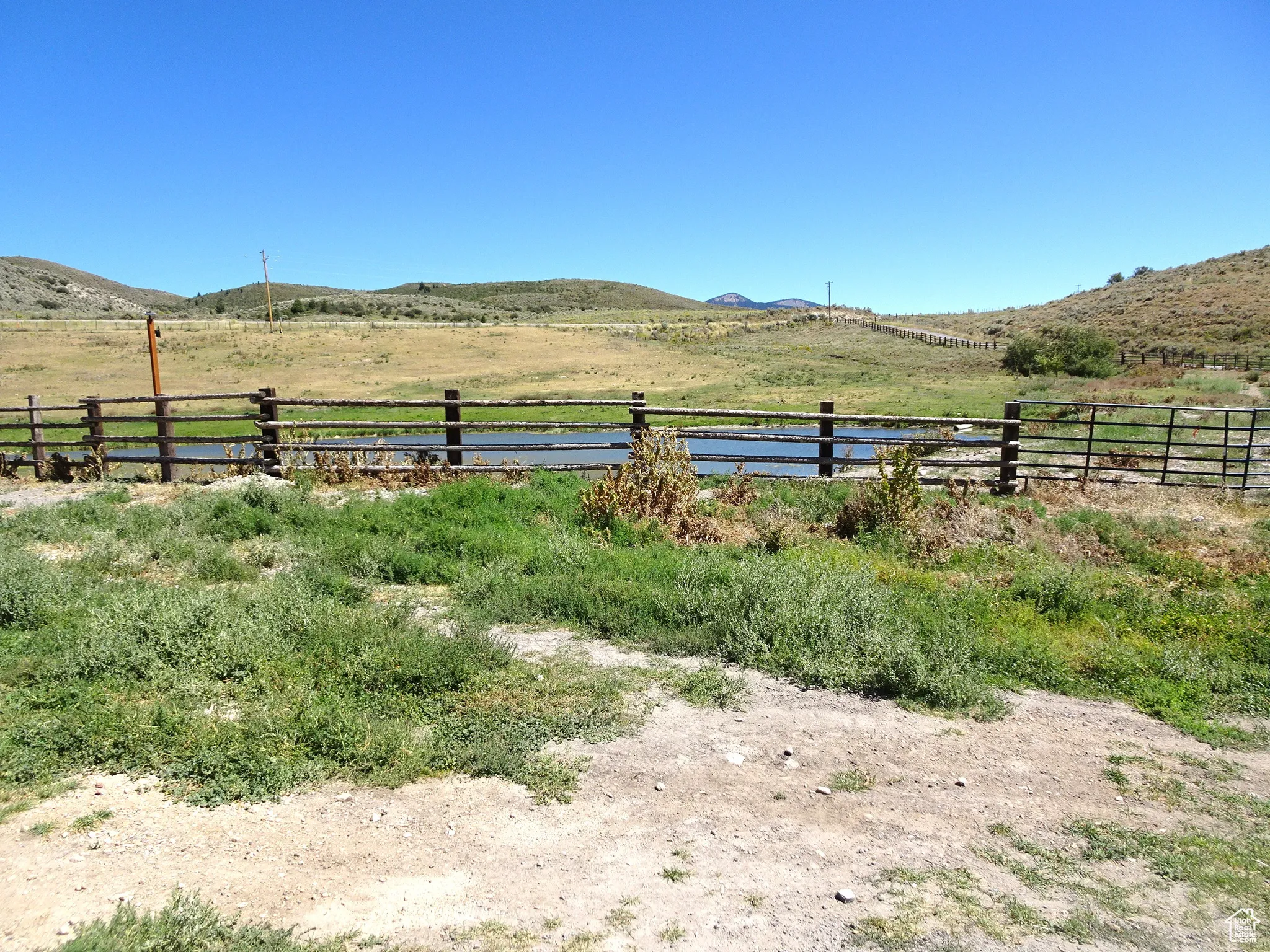 View of yard featuring a view of rural / pastoral area and a mountain view