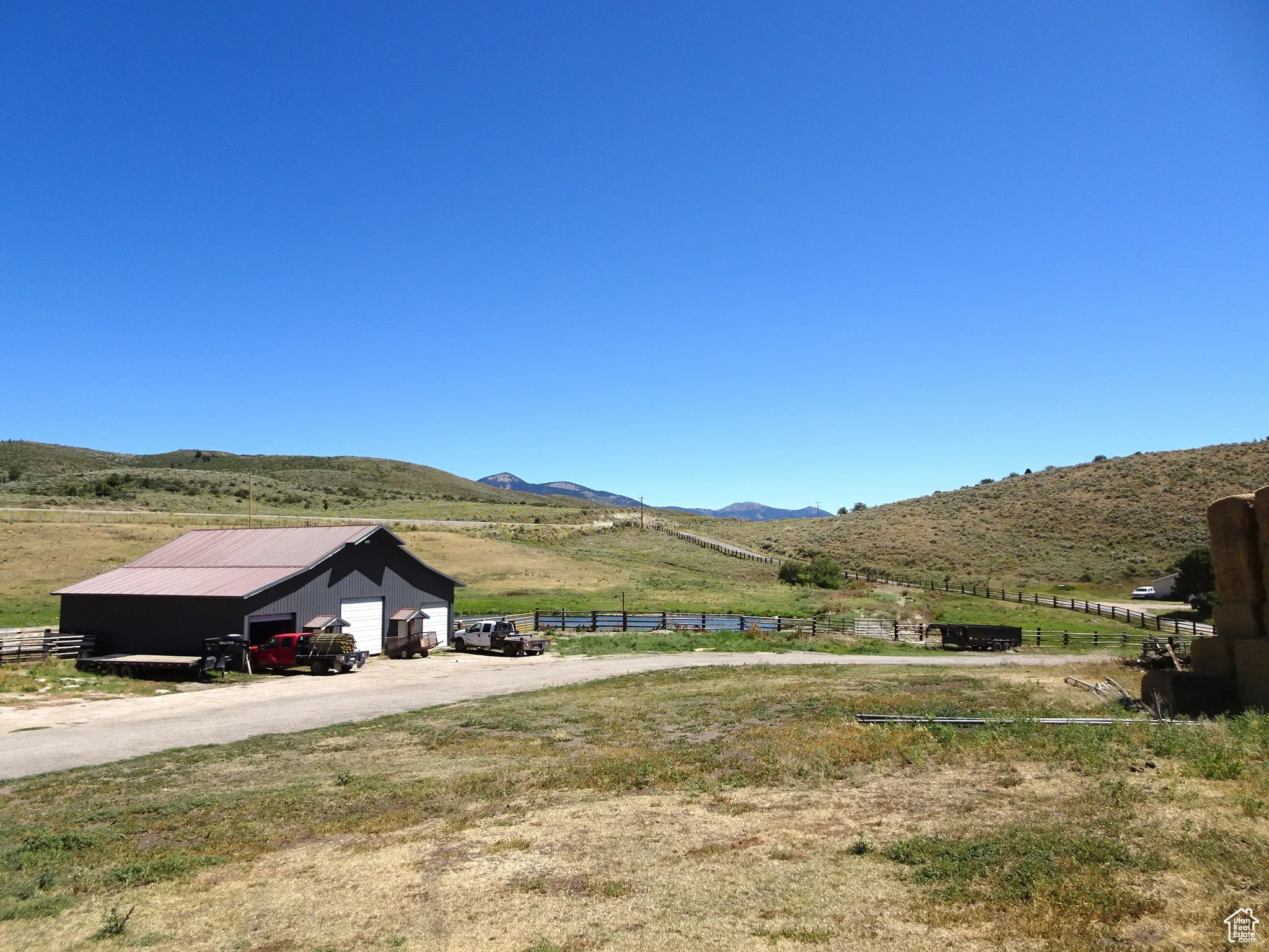 View of mountain backdrop featuring rural landscape and agricultural land
