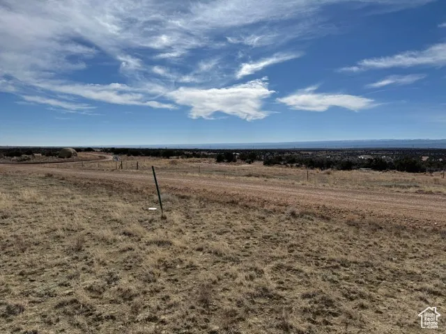 View of yard with a rural view