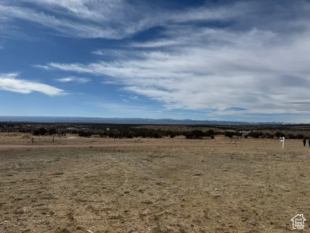 Property view of mountains with a rural view