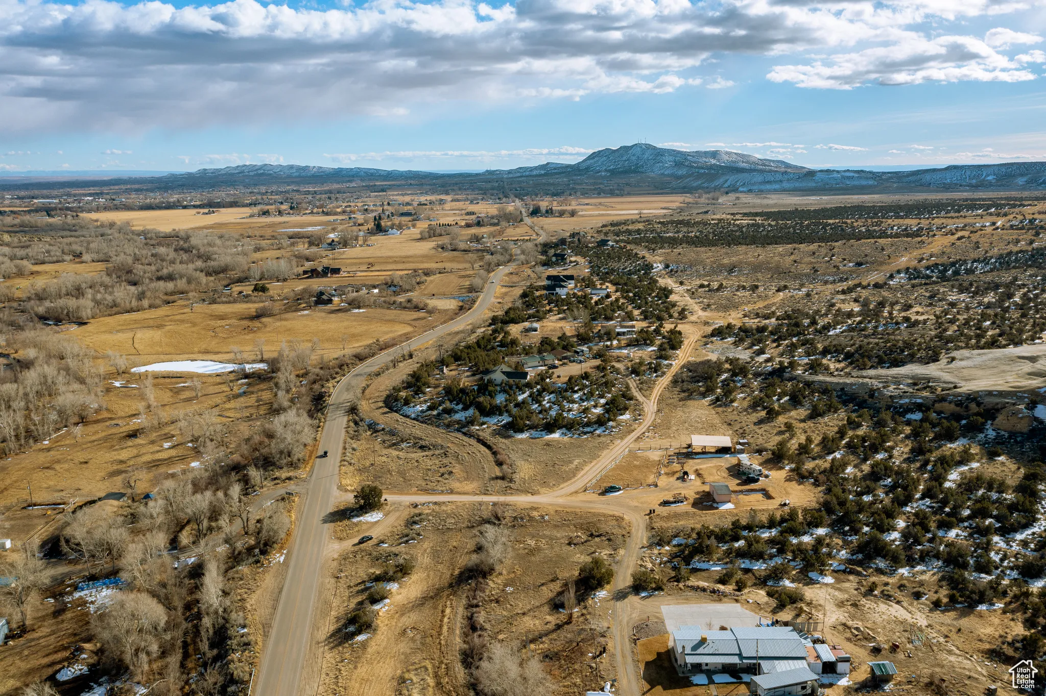 Birds eye view of property with a mountain view