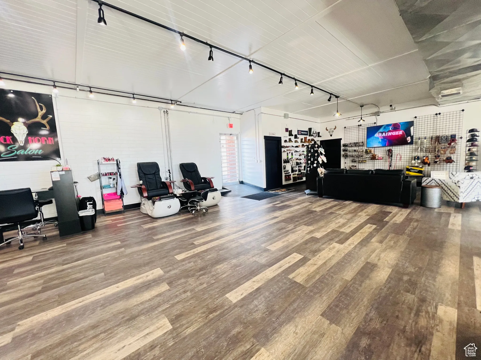 Misc room with track lighting and wood finished floors