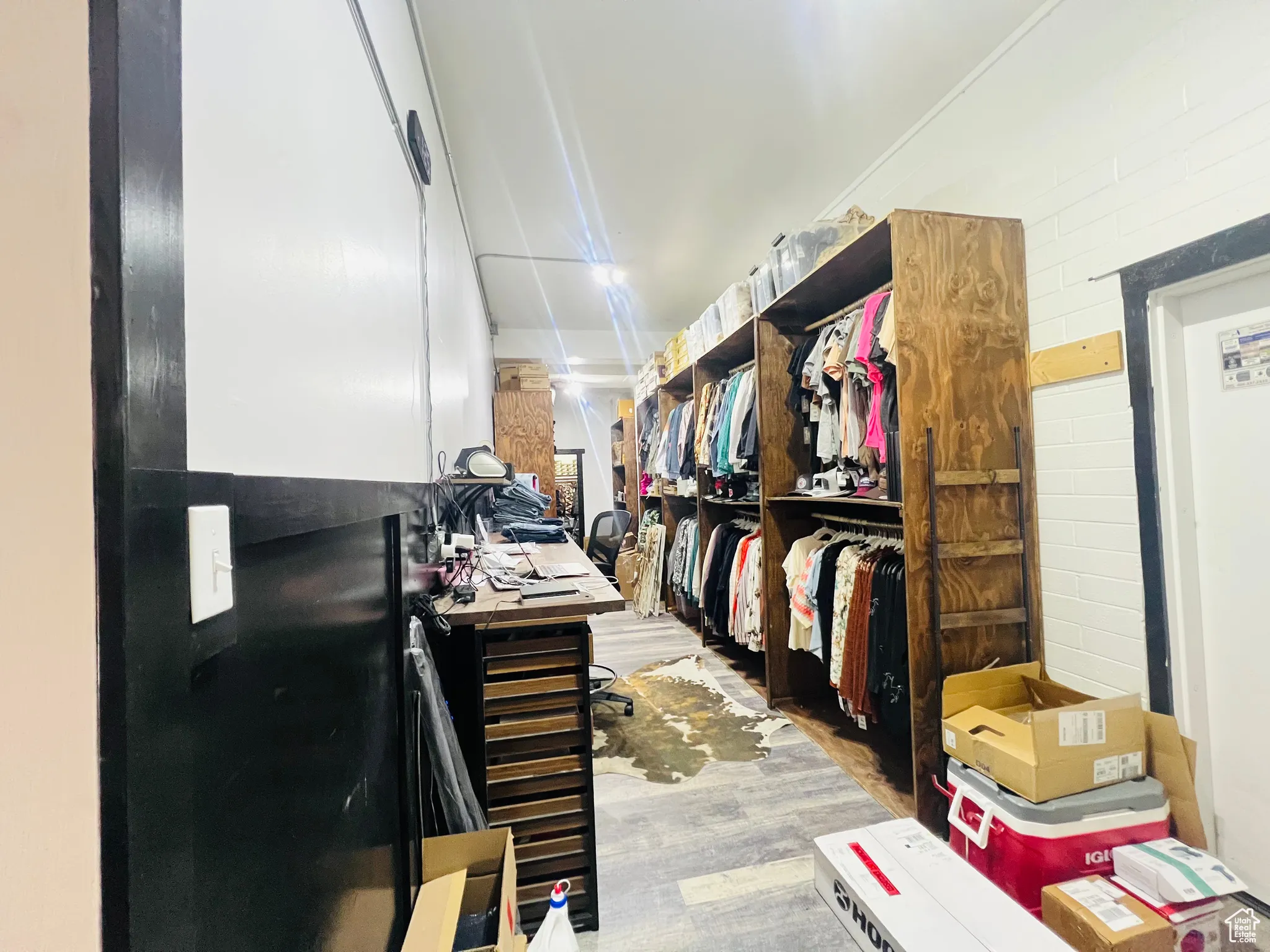 Walk in closet featuring wood finished floors