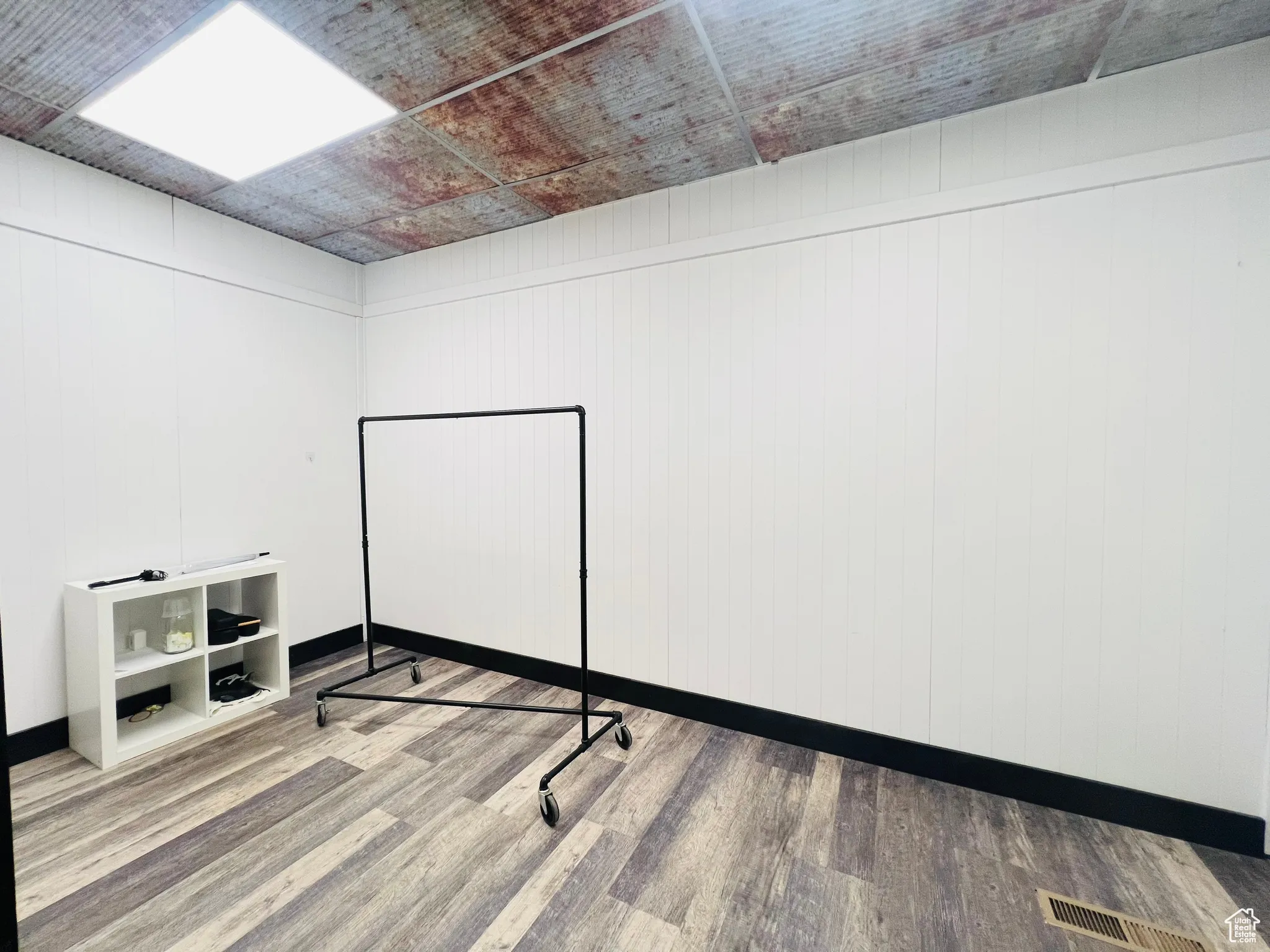 Basement featuring wood finished floors and baseboards